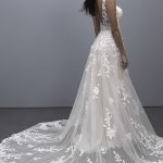 Trailing vines are strewn across the tulle overlay of this A-line gown